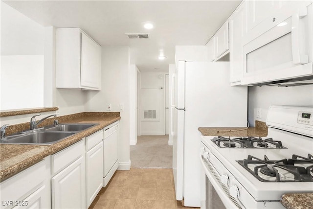 2801 N Rainbow Blvd Unit 235, Las Vegas, NV 89108 - kitchen with white appliances, white cabinets, recessed lighting, and light tile patterned floors