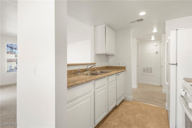 2801 N Rainbow Blvd Unit 235, Las Vegas, NV 89108 - kitchen featuring light colored carpet, white appliances, white cabinets, recessed lighting, and light countertops