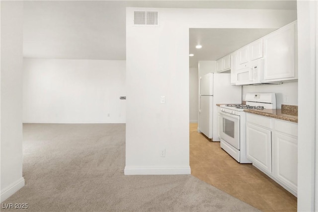 2801 N Rainbow Blvd Unit 235, Las Vegas, NV 89108 - kitchen featuring white appliances, white cabinetry, light colored carpet, and recessed lighting