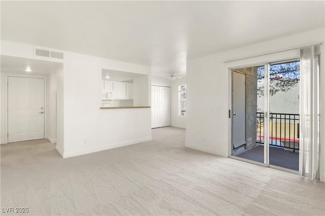 2801 N Rainbow Blvd Unit 235, Las Vegas, NV 89108 - unfurnished living room with light colored carpet and ceiling fan