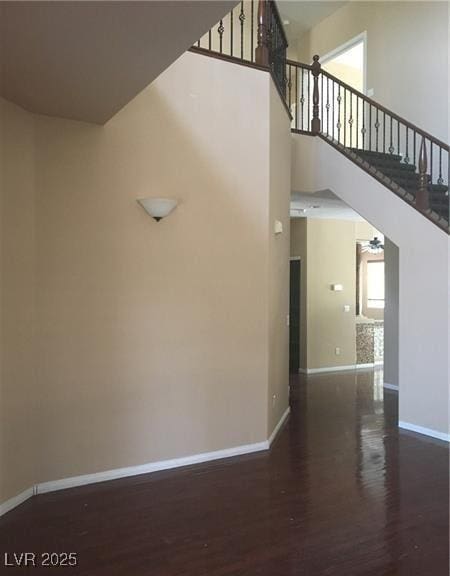 7414 Page Ranch Ct, Las Vegas, NV 89131 - staircase with wood finished floors and a high ceiling