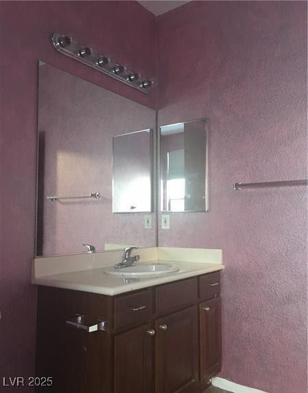 7414 Page Ranch Ct, Las Vegas, NV 89131 - bathroom with vanity and a textured wall