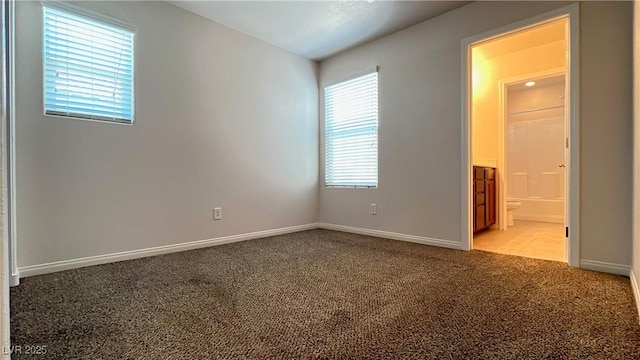 7469 Paces Mill Ct, Las Vegas, NV 89113 - unfurnished bedroom featuring light colored carpet and ensuite bath