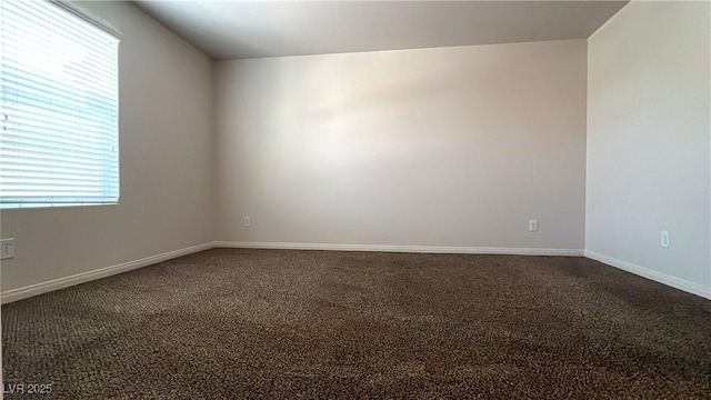 7469 Paces Mill Ct, Las Vegas, NV 89113 - spare room featuring dark colored carpet and baseboards