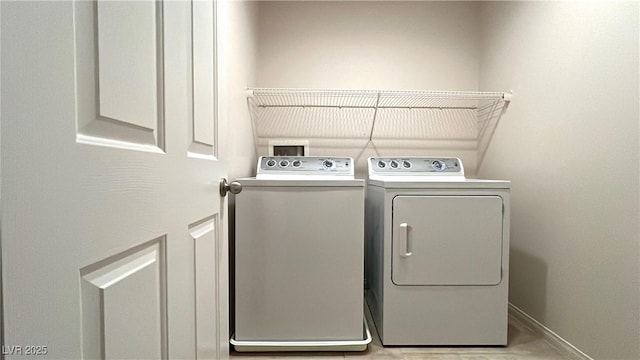 7469 Paces Mill Ct, Las Vegas, NV 89113 - laundry room featuring washing machine and dryer and baseboards