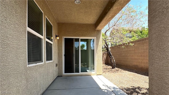 7469 Paces Mill Ct, Las Vegas, NV 89113 - entrance to property with stucco siding and a patio