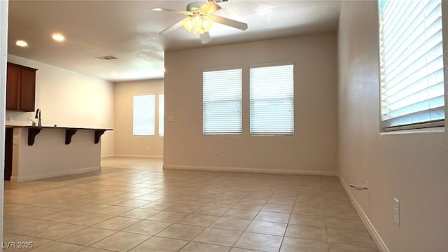 7469 Paces Mill Ct, Las Vegas, NV 89113 - unfurnished living room featuring light tile patterned flooring, ceiling fan, and recessed lighting