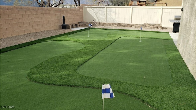 6117 Glenborough St, Las Vegas, NV 89115 - view of home's community featuring a putting area and a fenced backyard