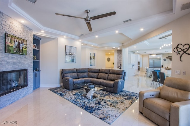 1890 Pago Ct, Las Vegas, NV 89117 - living area with a raised ceiling, a ceiling fan, a fireplace, recessed lighting, and built in features