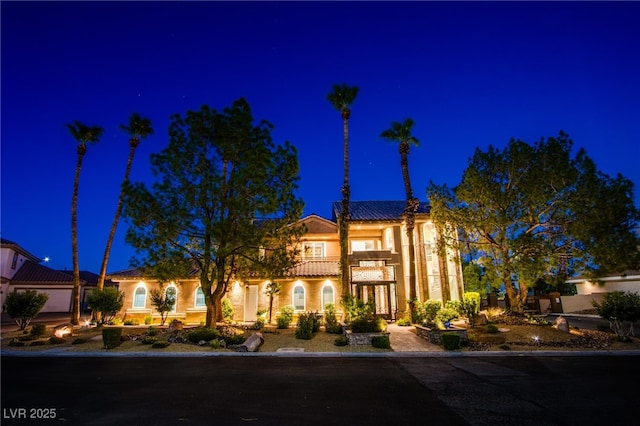 1890 Pago Ct, Las Vegas, NV 89117 - mediterranean / spanish-style house with stucco siding, a tiled roof, and a balcony