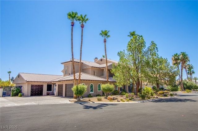 1890 Pago Ct, Las Vegas, NV 89117 - view of building exterior with an attached garage and concrete driveway