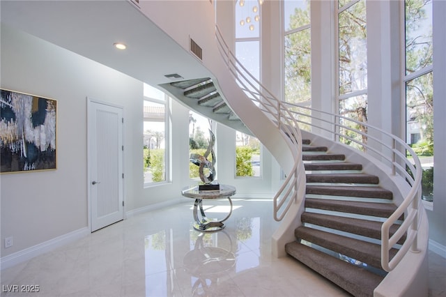 1890 Pago Ct, Las Vegas, NV 89117 - staircase with marble tiled floors and recessed lighting