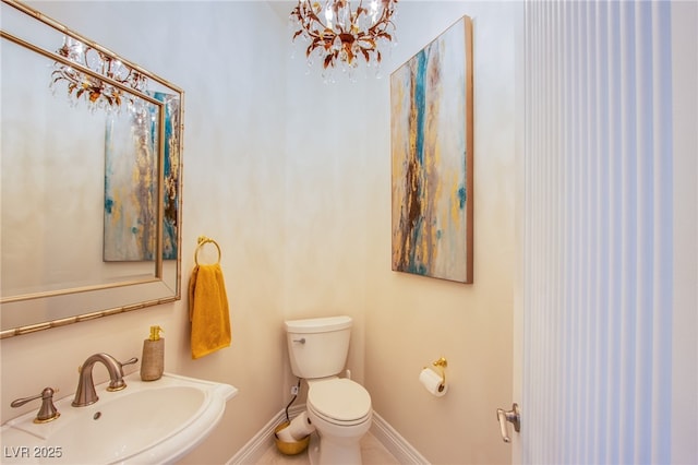 1890 Pago Ct, Las Vegas, NV 89117 - bathroom featuring a sink and a chandelier