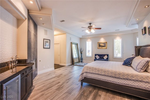 1890 Pago Ct, Las Vegas, NV 89117 - bedroom with beverage cooler, light wood-style flooring, crown molding, and recessed lighting