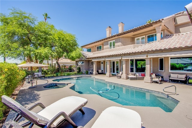 1890 Pago Ct, Las Vegas, NV 89117 - view of pool featuring a patio area, an outdoor hangout area, and a pool with connected hot tub