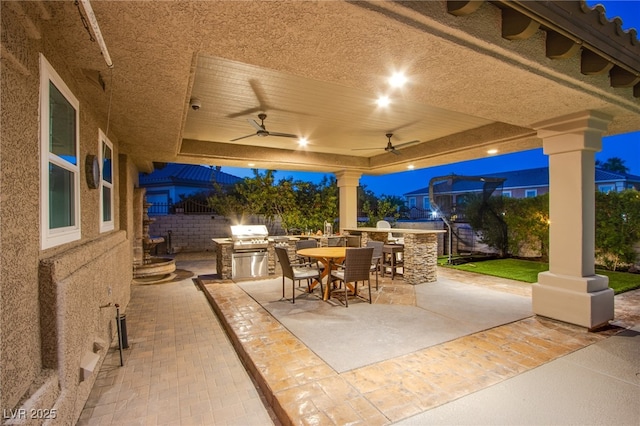 1890 Pago Ct, Las Vegas, NV 89117 - view of patio / terrace with an outdoor kitchen, outdoor dining space, and a ceiling fan