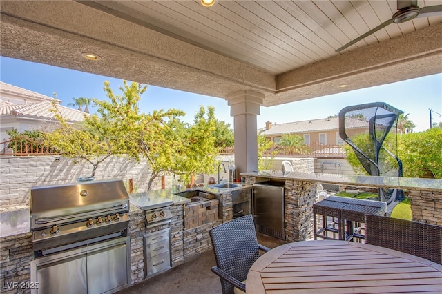 1890 Pago Ct, Las Vegas, NV 89117 - view of patio with an outdoor kitchen, an outdoor bar, and outdoor dining space