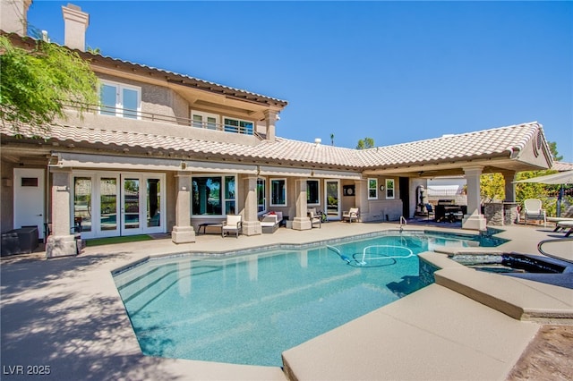 1890 Pago Ct, Las Vegas, NV 89117 - view of swimming pool with french doors, a patio area, and a pool with connected hot tub
