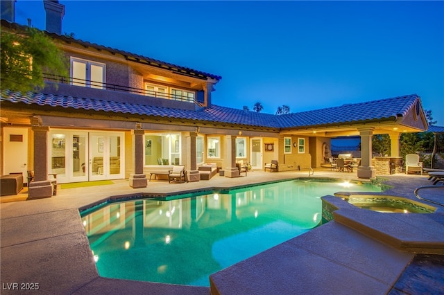 1890 Pago Ct, Las Vegas, NV 89117 - back of house featuring a balcony, an outdoor hangout area, a patio, french doors, and a tiled roof