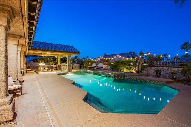 1890 Pago Ct, Las Vegas, NV 89117 - view of swimming pool featuring a patio, a pool with connected hot tub, and a fenced backyard