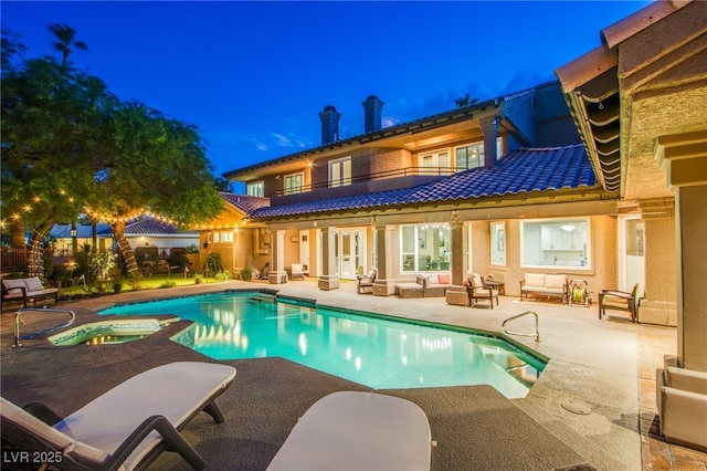 1890 Pago Ct, Las Vegas, NV 89117 - back of property with a balcony, an outdoor hangout area, a patio area, a tiled roof, and a pool with connected hot tub