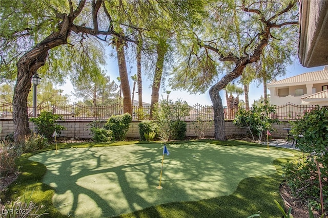 1890 Pago Ct, Las Vegas, NV 89117 - fenced backyard with an area to practice putting