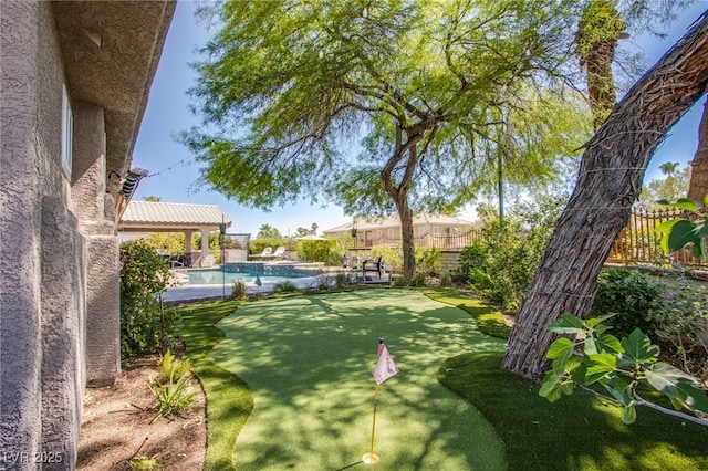 1890 Pago Ct, Las Vegas, NV 89117 - fenced backyard with a putting green