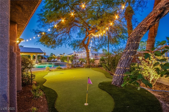 1890 Pago Ct, Las Vegas, NV 89117 - fenced backyard featuring a putting area and a pool