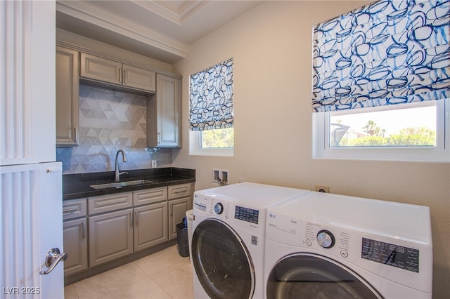 1890 Pago Ct, Las Vegas, NV 89117 - laundry room featuring washing machine and clothes dryer, cabinet space, and light tile patterned floors