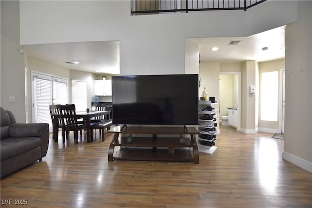 6628 Ives Ave, Las Vegas, NV 89108 - living area with wood finished floors and a towering ceiling