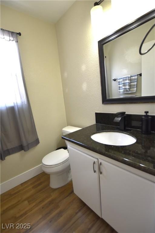 6628 Ives Ave, Las Vegas, NV 89108 - bathroom featuring vanity and wood finished floors