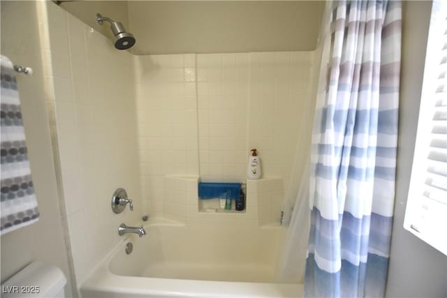 6628 Ives Ave, Las Vegas, NV 89108 - bathroom featuring shower / tub combo with curtain and toilet