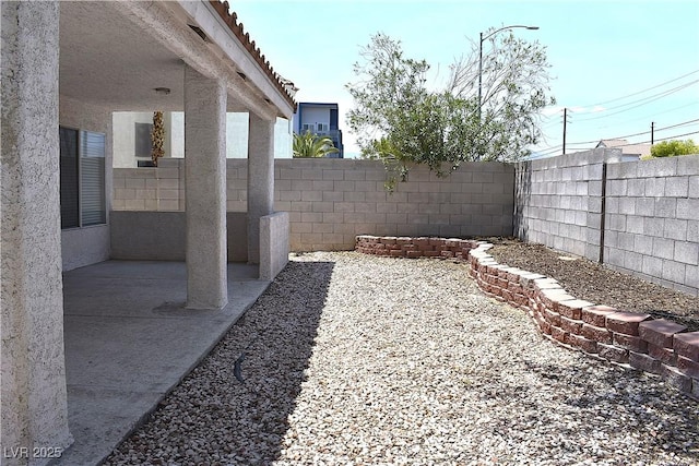6628 Ives Ave, Las Vegas, NV 89108 - fenced backyard with a patio