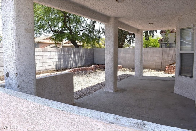 6628 Ives Ave, Las Vegas, NV 89108 - fenced backyard featuring a patio