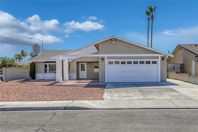 1841 Feather Way, Las Vegas, NV 89108 - ranch-style home featuring stucco siding, concrete driveway, a garage, and a chimney