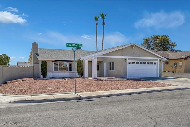 1841 Feather Way, Las Vegas, NV 89108 - ranch-style house with an attached garage, driveway, a chimney, stucco siding, and brick siding