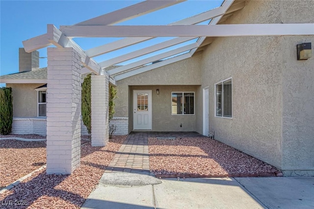 1841 Feather Way, Las Vegas, NV 89108 - property entrance featuring stucco siding and a chimney