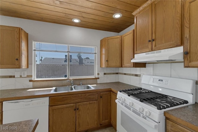 1841 Feather Way, Las Vegas, NV 89108 - kitchen featuring white appliances, under cabinet range hood, wood ceiling, dark countertops, and tasteful backsplash