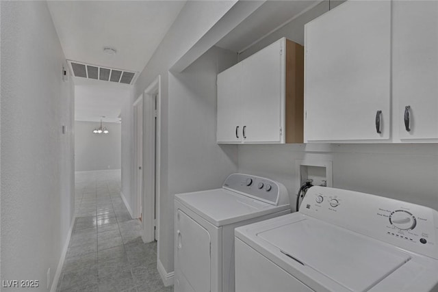 1841 Feather Way, Las Vegas, NV 89108 - laundry room featuring independent washer and dryer, light tile patterned flooring, and cabinet space