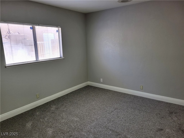 1841 Feather Way, Las Vegas, NV 89108 - empty room with dark carpet and baseboards