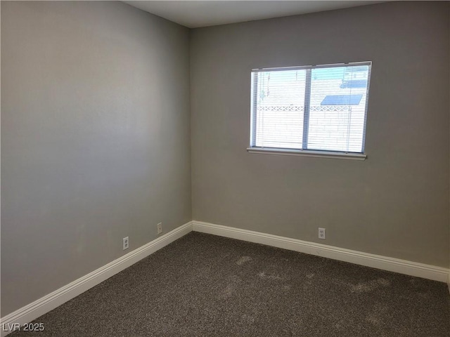 1841 Feather Way, Las Vegas, NV 89108 - empty room featuring dark colored carpet and baseboards