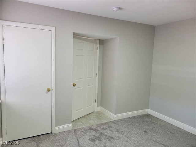 1841 Feather Way, Las Vegas, NV 89108 - unfurnished bedroom with carpet floors and tile patterned flooring