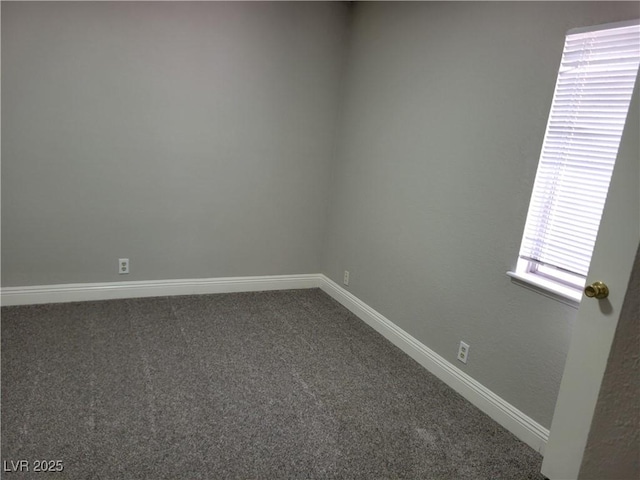 1841 Feather Way, Las Vegas, NV 89108 - empty room with dark colored carpet and baseboards