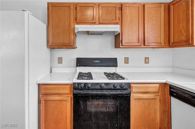 2165 Saint Paul Way, Las Vegas, NV 89104 - kitchen featuring white appliances, under cabinet range hood, light countertops, and brown cabinetry