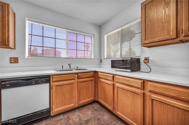 2165 Saint Paul Way, Las Vegas, NV 89104 - kitchen featuring dishwasher, stainless steel microwave, plenty of natural light, and light countertops