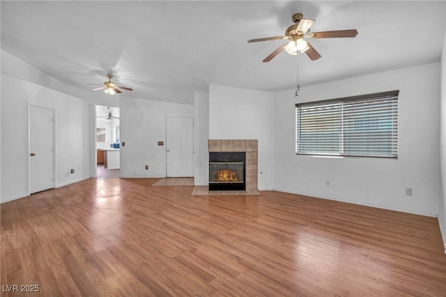 2165 Saint Paul Way, Las Vegas, NV 89104 - unfurnished living room with ceiling fan, plenty of natural light, and light wood finished floors