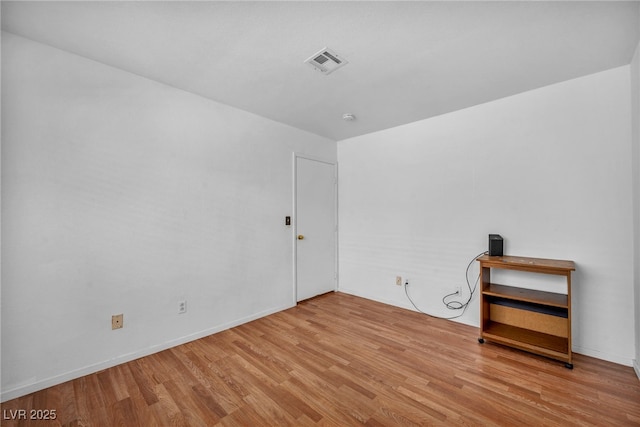 2165 Saint Paul Way, Las Vegas, NV 89104 - spare room featuring wood finished floors and a smoke detector