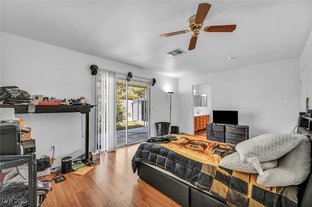2165 Saint Paul Way, Las Vegas, NV 89104 - bedroom featuring access to exterior, light wood-style floors, a ceiling fan, and connected bathroom