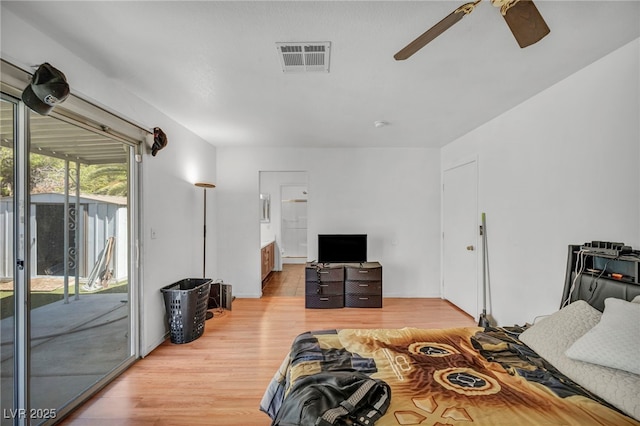2165 Saint Paul Way, Las Vegas, NV 89104 - bedroom with access to outside, wood finished floors, ensuite bathroom, and a ceiling fan