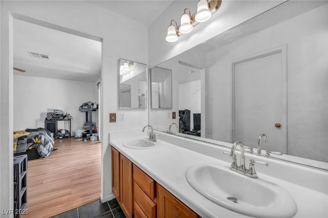2165 Saint Paul Way, Las Vegas, NV 89104 - bathroom with double vanity and tile patterned flooring